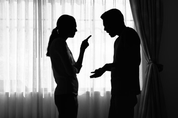 silhouette of couple arguing fighting at home, family issues, marriage relationship problems	