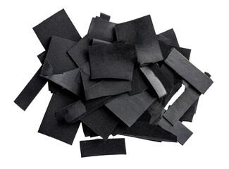 Pile of dark, fragmented, rectangular pieces