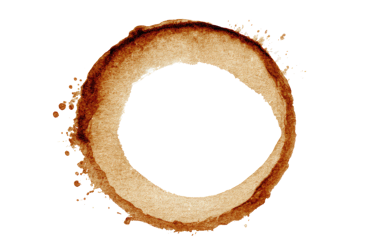 Circular coffee stain.  A perfect ring of light brown stain, with a dark center hole, against a black background.  Splashes and irregularities in the stain's outer edge
