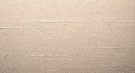 Fototapeta premium Close-up of a textured beige canvas fabric background with subtle horizontal lines and subtle wear