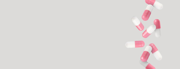 Pills falling against light grey background. Banner design with space for text