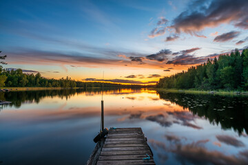 Hallangen lake pier at sunset. Kalmar region. Sweden