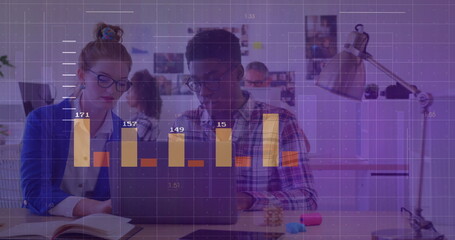 Woman in blazer and man analyzing laptop data at desk with desk lamp and chart overlay