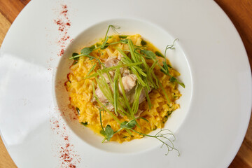 Indulge in a Delicious Gourmet Risotto, Crafted with Fresh Herbs and Exquisite Seafood Ingredients