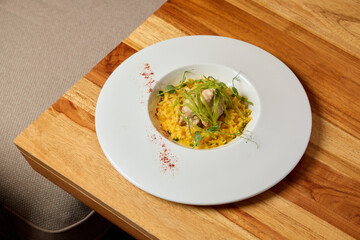 An Elegant and Beautiful Plate of a Gourmet Rice Dish prepared with Fresh and Flavorful Ingredients