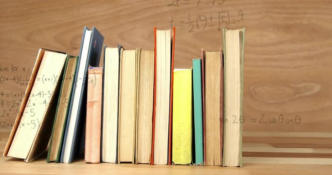 Handwriting sin2? formula starting equations showing on books plotting axes and graphing curve