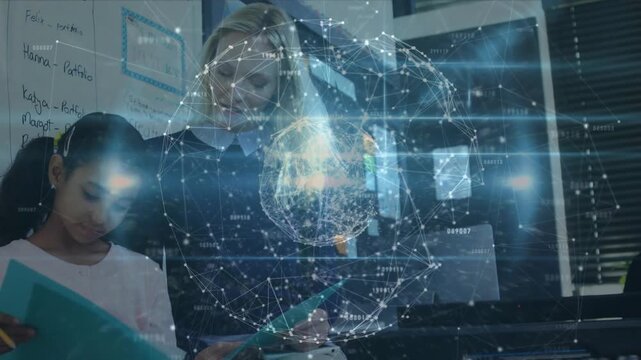 Teacher pointing teal workbook and guiding student writing under holographic globe in classroom