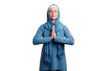 Peaceful Muslim woman in a blue hijab praying with her hands together.