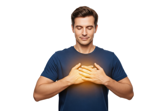 Man with a glowing heart holding his chest to express gratitude and self-love.