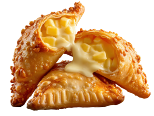 Savory Turnover Delight: Captivating a shot of golden-brown pastries, each revealing a luscious, creamy interior brimming with tender pieces of fruit