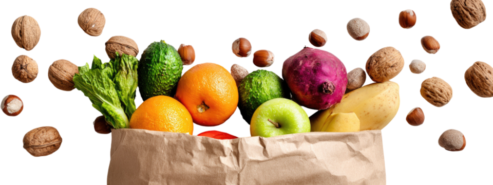 A paper bag overflowing with colorful fruits and vegetables, with nuts scattered around