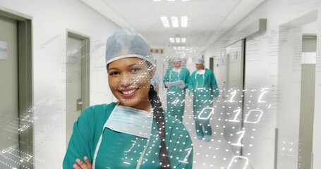 Female surgeon leading team walking corridor for surgery, activating binary data overlay - Powered by Adobe