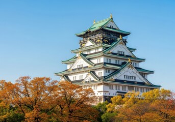 Obraz premium Majestic osaka castle in autumn with vibrant foliage
