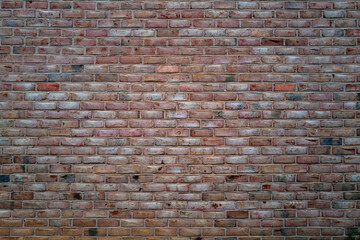 Brick wall made with bricks. Old red brick wall, masonry wall, stonework. Bric kwall background texture. Textured background of brickwall. Clinker brick.