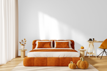 Isolated PNG cozy orange bed with pillows and cute plush pumpkins on transparent background with shadow, autumn Halloween interior decor