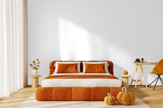 Isolated PNG cozy orange bed with pillows and cute plush pumpkins on transparent background with shadow, autumn Halloween interior decor