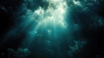 Fototapeta premium Abstract Dark Blue Water Background with Light Beams Sparkling Shimmers and Magical Underwater Atmosphere in a Deep Ocean
