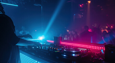 Dj mixing music in nightclub