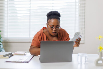 Fototapeta premium Unhappy woman feeling stressed calculating monthly expenses at home, facing financial problems or lack of money for utility household or rental payments, bankruptcy concept. 