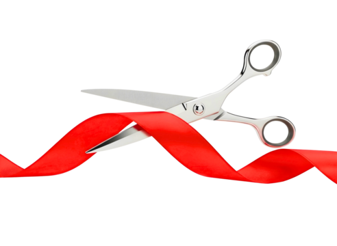 Silver scissors cutting red ribbon isolated on transparent background
