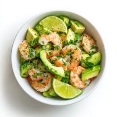 Healthy shrimp salad bowl with avocado, cherry tomatoes, greens, and lime wedge, seasoned with herbs and spices for freshness.

