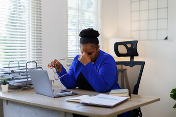 Overworked tired african female worker holding glasses feel eye strain fatigue after computer work multiracial woman suffer from pain in dry irritated eyes bad blurry vision eyesight problem