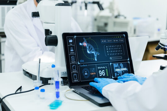 Scientists analyzing DNA data in high-tech lab.