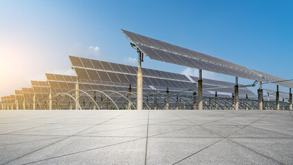 Large-scale solar panel array under clear blue sky