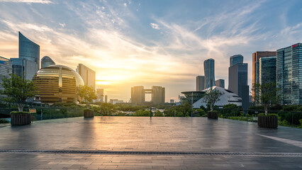 Modern city skyline at sunset with urban architecture