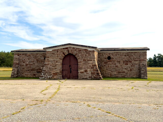 Wooden doors on an old stone chapel