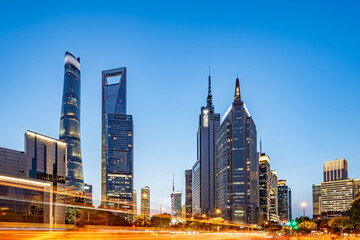 Fototapeta premium Modern city skyline with tall skyscrapers under clear blue sky