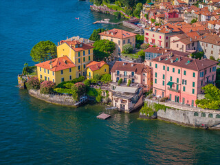 Varenna, Lombardy. Picturesque village in Como Lake, Italy. Aerial panoramic drone view of beautiful town with colorful houses surrounded by mountains