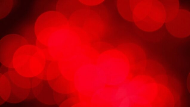 Vibrant red bokeh lights abstract background with soft focus