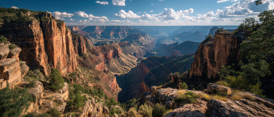 Expansive canyon with dramatic layered rock formations under clear blue sky