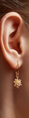Fototapeta premium Festive Gold Snowflake Earring Close-Up on Human Ear Authentic Christmas and Hanukkah Style for Premium Holiday Marketing Campaigns