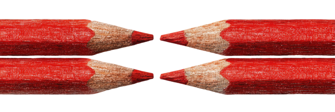 Two red pencils in close-up, showing the wooden core and pointed tips.  The pencils are arranged in a symmetrical X shape against a black background
