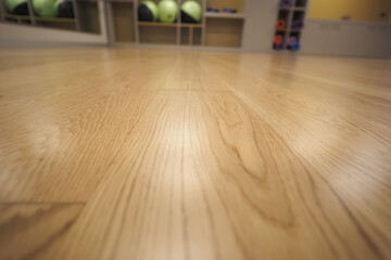 Wooden floor in a bowling alley with visible equipment