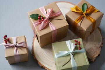 Fototapeta premium Beautifully wrapped gifts tied with ribbons and berries for special occasions