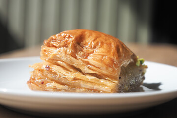 Delicious baklava dessert on a white plate