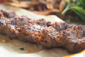 Deliciously grilled skewers served with fresh herbs