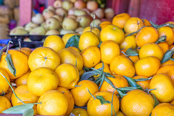Fresh mandarins in natural light, with vibrant texture and rich color. Perfect for themes of health, freshness, organic food, and Mediterranean lifestyle.
