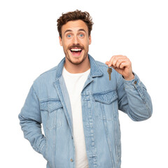 Happy young man holding keys on transparent background