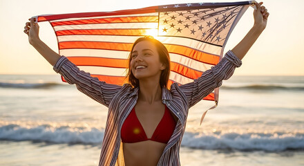 Young woman holding american flag on beach at sunset