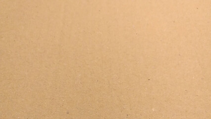 Background of brown kraft paper or cardboard texture, crumpled paper texture as a beige background