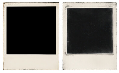 Two empty vintage polaroid style photo frames, showing signs of age