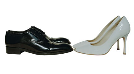 Formal shoes, black and white, facing each other