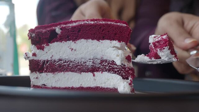 Red velvet cake served for dessert at a cafe with friends