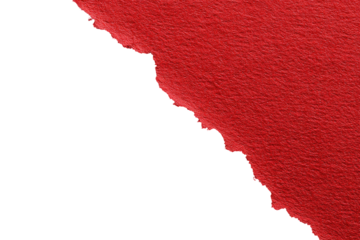 Red paper torn at an angle against black background