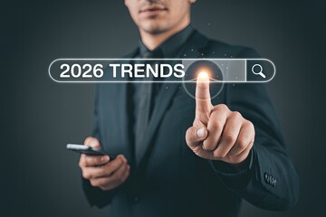 Futuristic businessman interacting with digital interface showing 2026 trends in technology and future concepts