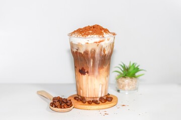 Ice mocha coffee serving on wooden plates with white background concept.